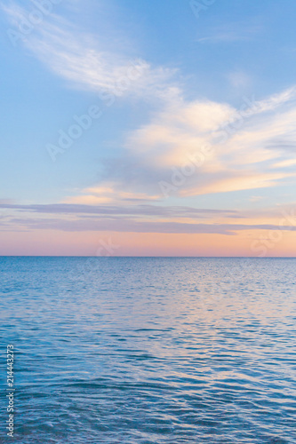 Beautiful summer sunset with clouds over the sea