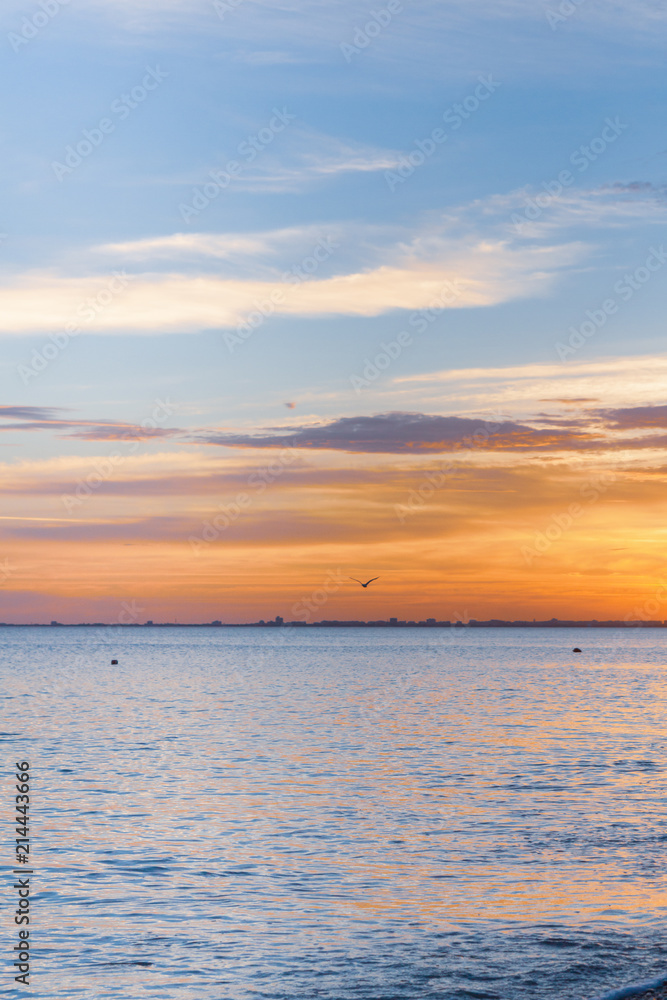 Beautiful summer sunset with clouds over the sea