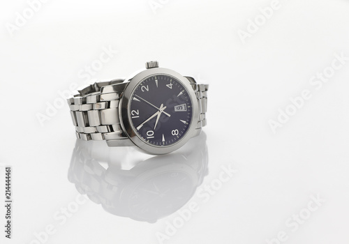 Closeup man stainless steel bracelet watch on a white background