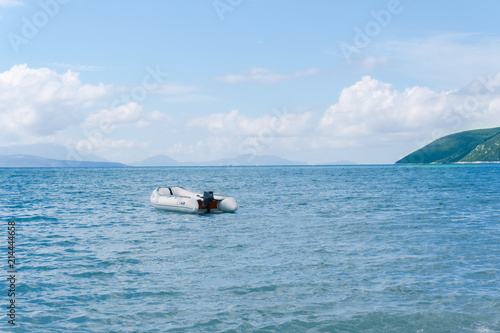 White motor boat on blue ocean © zalexis