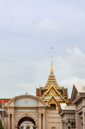 Golden artisan facade and roof of Bangkok Grand Palace "Chakri Maha Prasat" throne hall