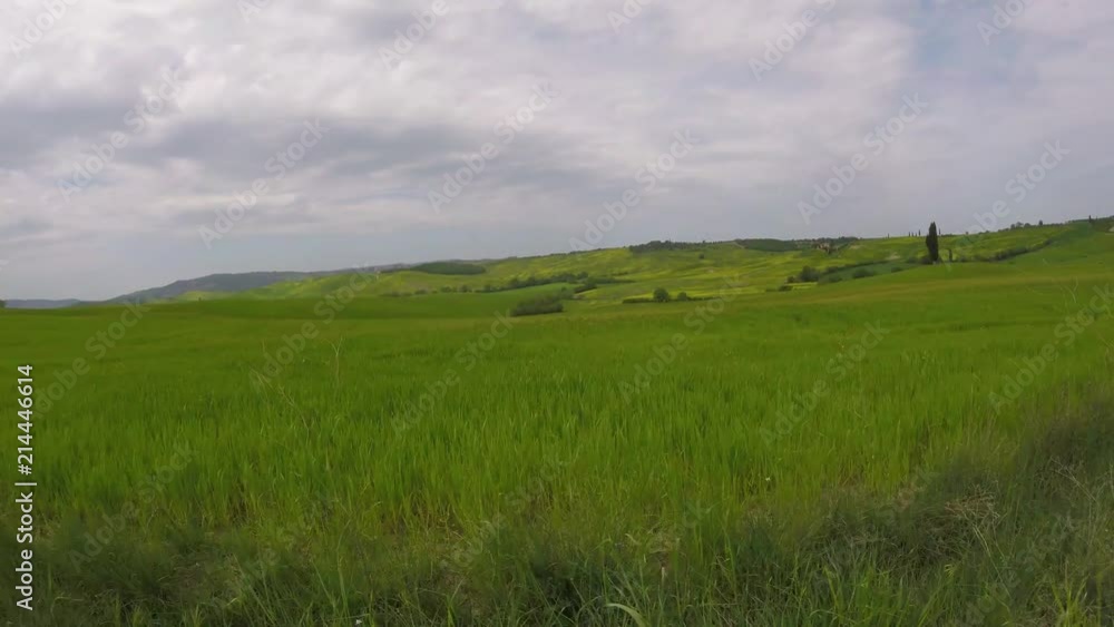 The view from the car on tuscan hills in Val d’Orcia, Tuscany, Italy The view from the car on tuscan hills in Val d’Orcia, Tuscany, Italy