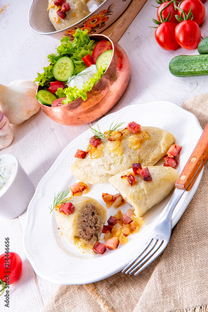 Rustic Cepelinai, a specialty Lithuanian and Polish cuisine. Rustic Cepelinai, a specialty Lithuanian and Polish cuisine.