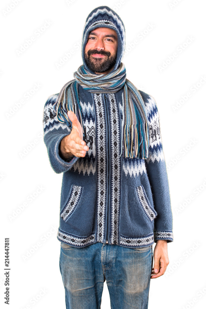 Man with winter clothes making a deal Man with winter clothes making a deal