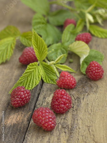 raspberries on a wooden background. 