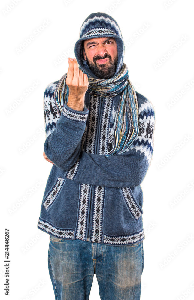 Man with winter clothes making money gesture Man with winter clothes making money gesture