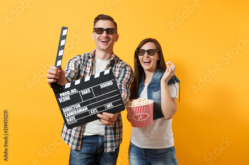 Young laughing couple woman man in 3d glasses watching movie film on date hol...