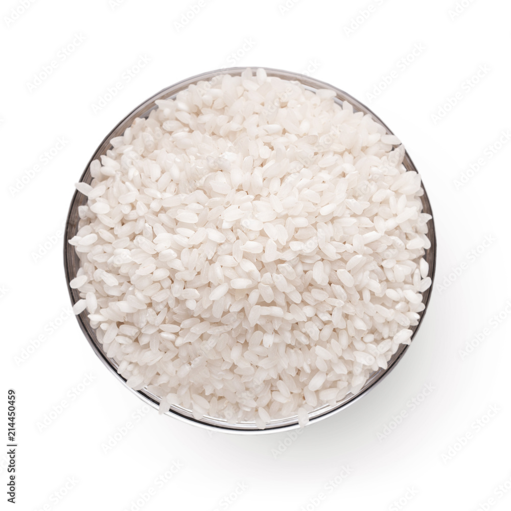 Uncooked white rice in bowl isolated Uncooked white rice in bowl isolated