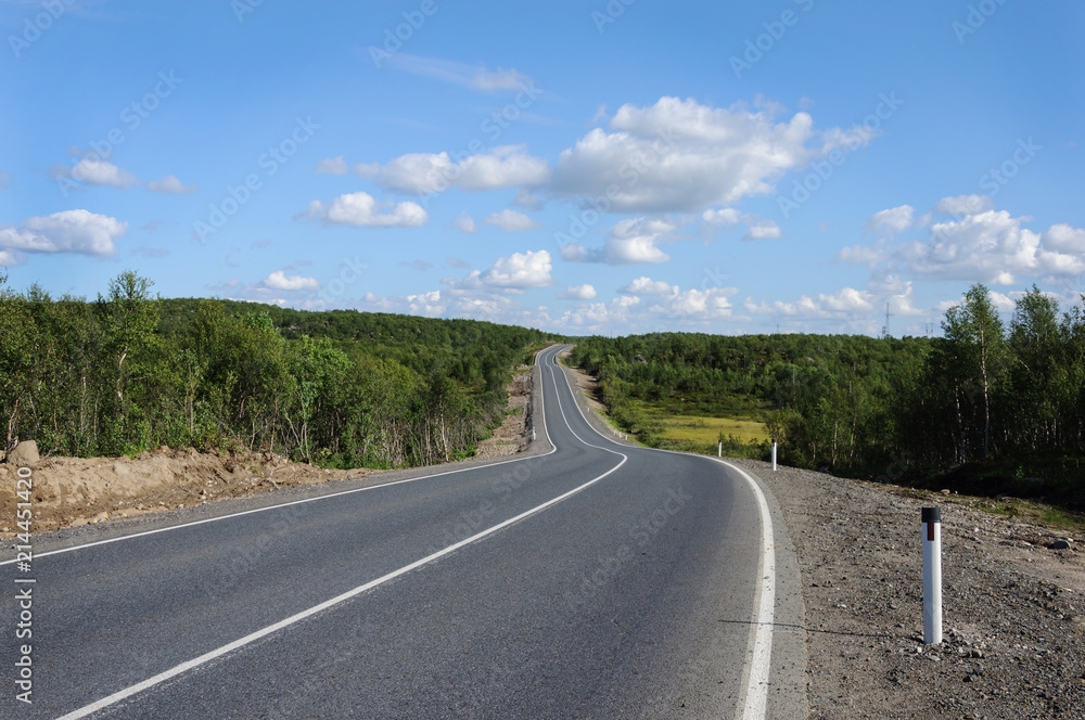 Asphalt road across the hills