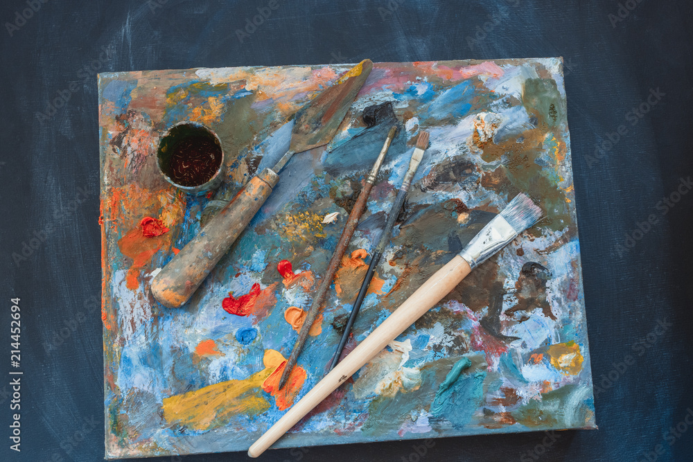 artists brushes and oil paints on palette.