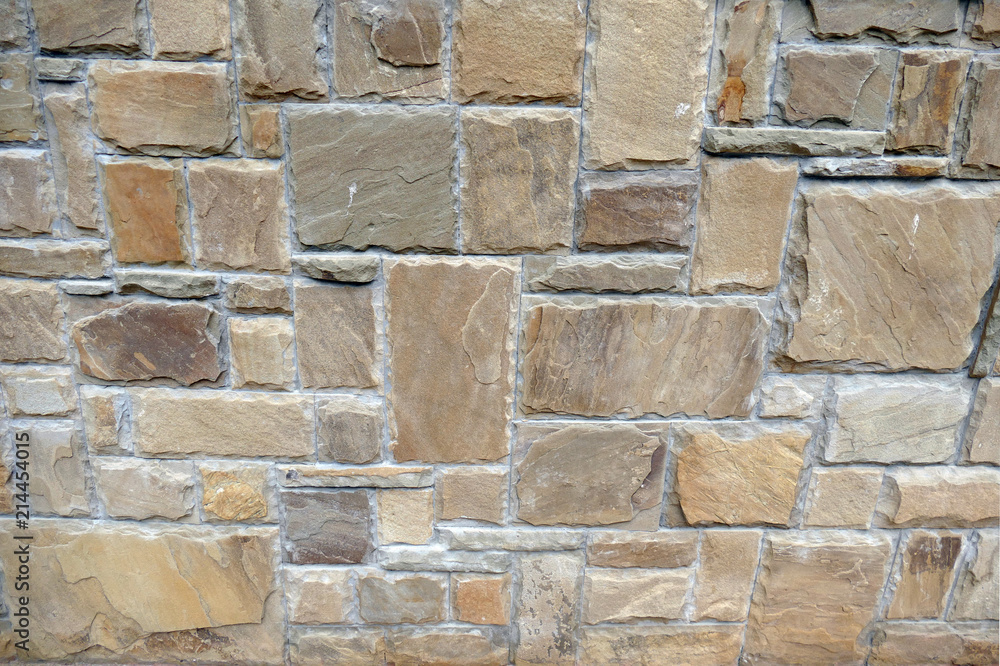 Fototapeta premium A wall lined with natural stone.