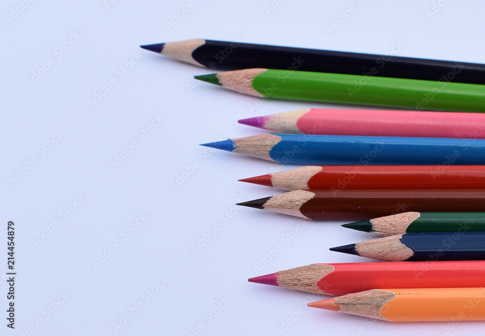 Fototapeta premium Color pencils on a white sheet