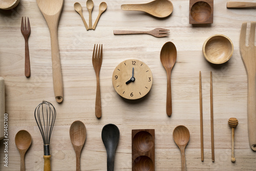 kitchen utensils and clock for cooking on the wooden table, time for food prepare concept