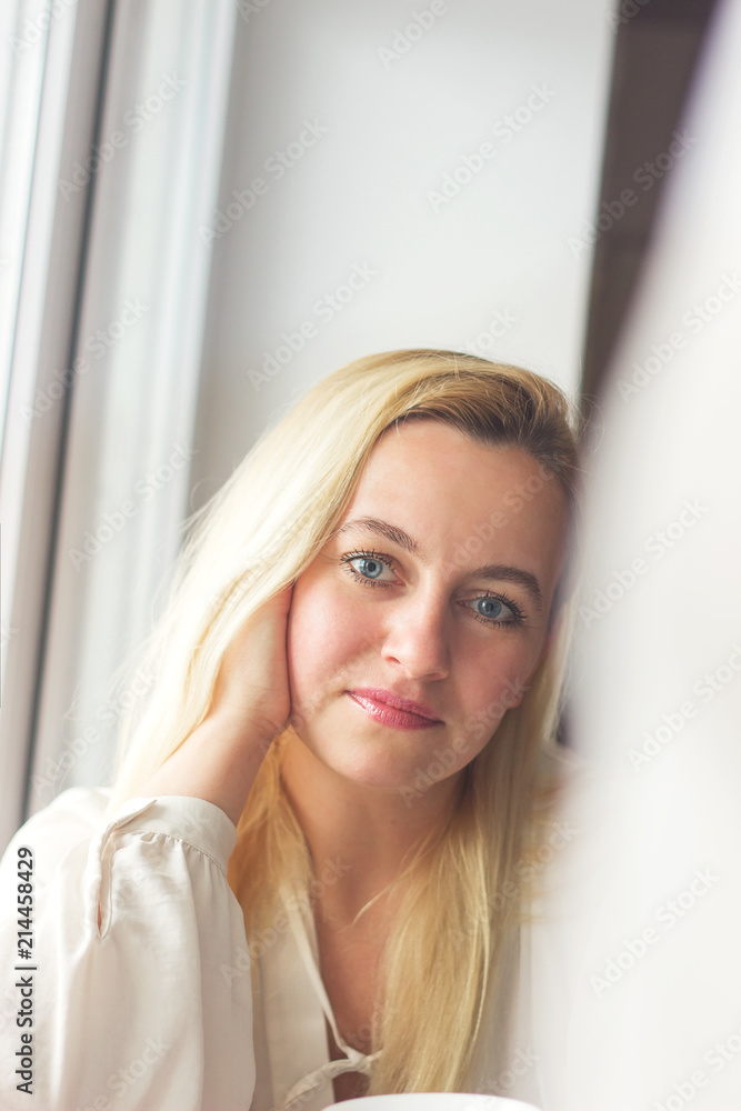 Beauty Woman face Portrait. Blond female looking at camera and smiling touching face. Beauty Woman face Portrait. Blond female looking at camera and smiling touching face.