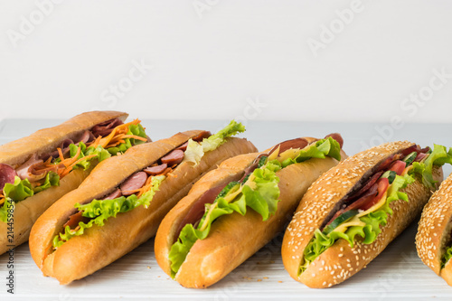 Fényképezés Fresh sub sandwich on white and wheat hoagies.