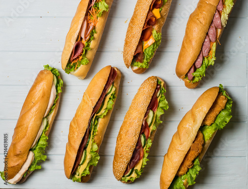 Fresh sub sandwich on white and wheat hoagies.
