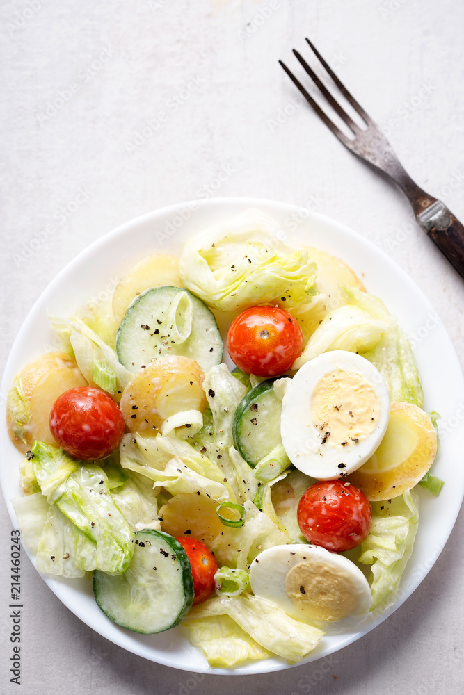 New potato, cherry tomatoes, lettuce, cucumber and egg mayo salad New potato, cherry tomatoes, lettuce, cucumber and egg mayo salad