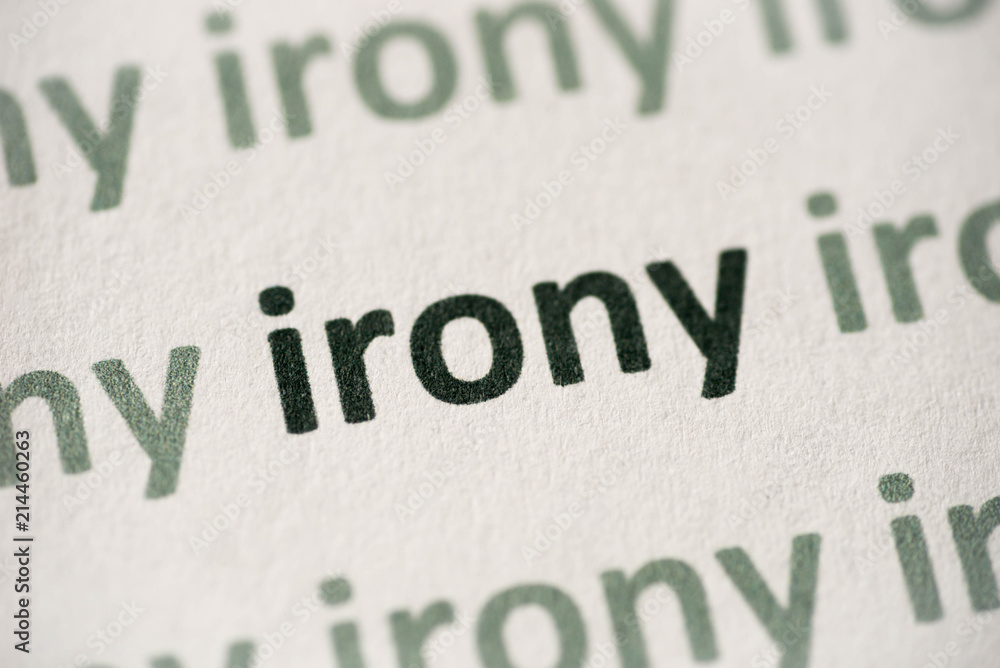Fotografie word irony printed on paper macro