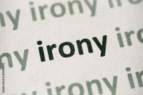 Fotografie word irony printed on paper macro