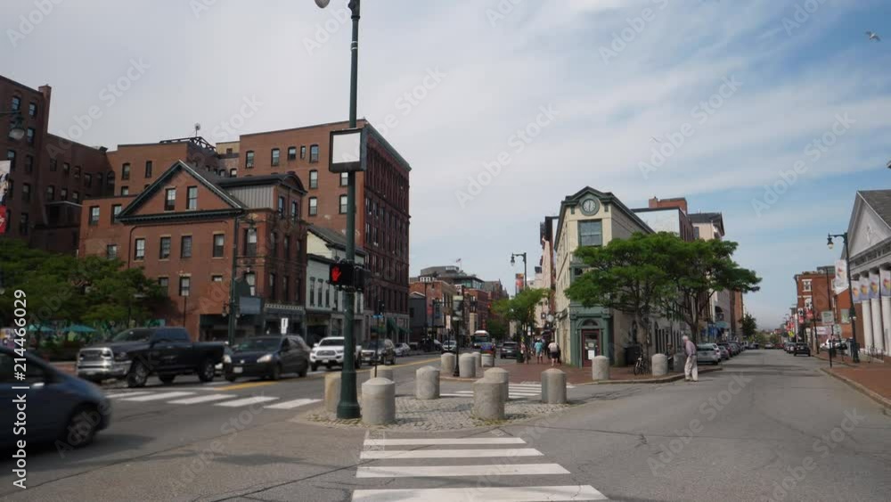 A daytime view of traffic and businesses along Congress Street in downtown Portland. A daytime view of traffic and businesses along Congress Street in downtown Portland.