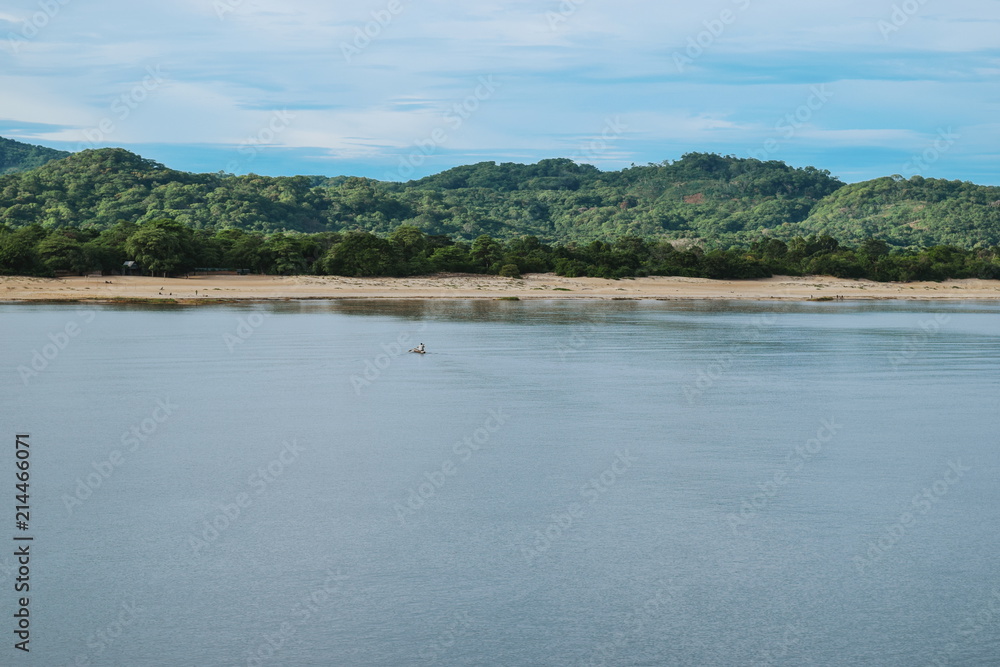 A fishing boat against a forest background, Lake Malawi, Malawi 