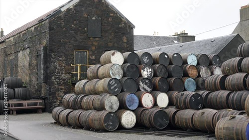 Stacks of oak barrels at a scotch whiskey distillery in Campbeltown  photo