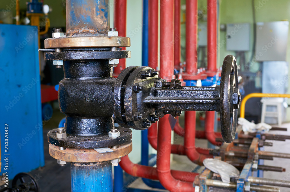 Old valves on the cold water pipeline. Industrial background. Old valves on the cold water pipeline. Industrial background.