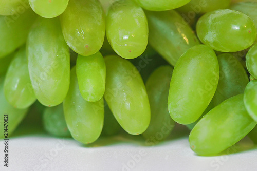Closeup of big bunch of fresh green table grapes, isolated on white background