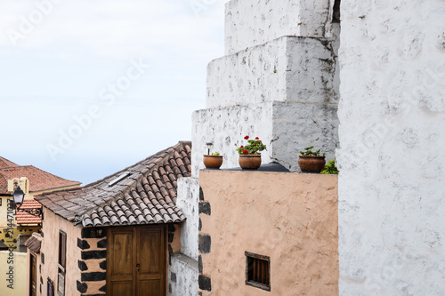 View over acient buildings with flowerpots with view to the sea in Orotava  Tenerife