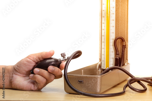 hand holding blood pressure monitor