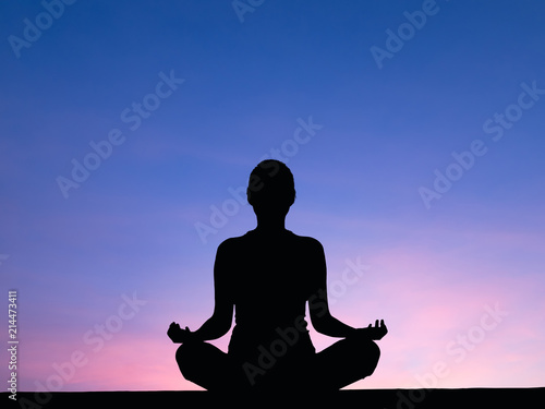 Silhouette woman meditate . photo