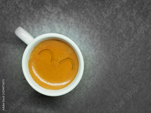 Cup of Espresso coffee on board background, Arabica with crema
