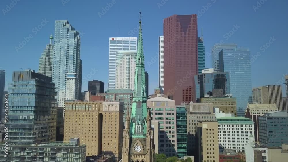 flying counter clockwise around steeple with Toronto skyline in BG flying counter clockwise around steeple with Toronto skyline in BG