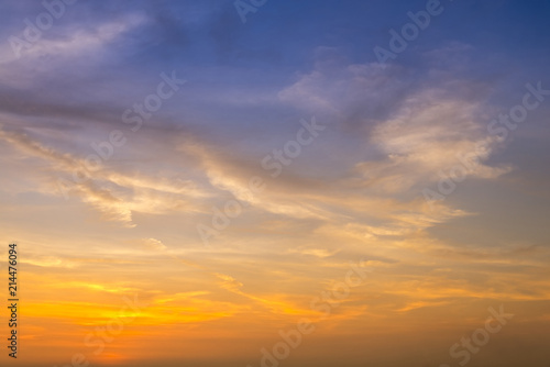 sunset / sun rise sky with rays of yellow and red light shining clouds and sky background and texture © lukyeee_nuttawut