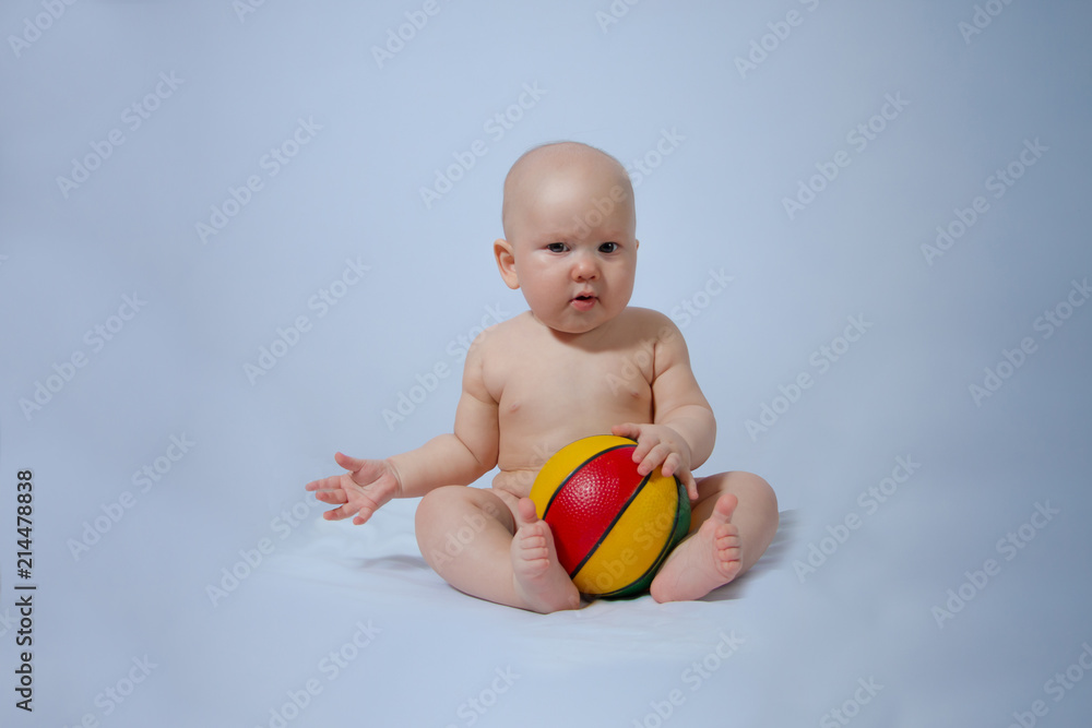 portrait of a kid who plays his ball on a gentle blue-gray background like the sky portrait of a kid who plays his ball on a gentle blue-gray background like the sky