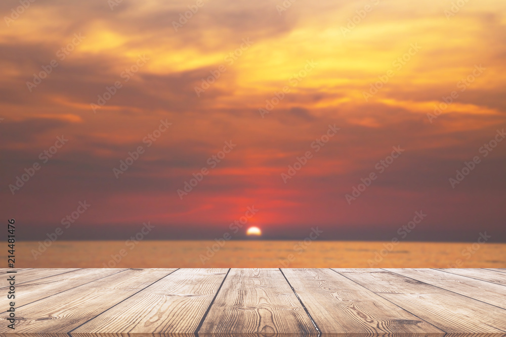 Empty wood table with beautiful sunset beach over the sea Empty wood table with beautiful sunset beach over the sea
