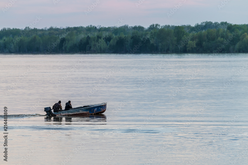 Boat on river with two mens