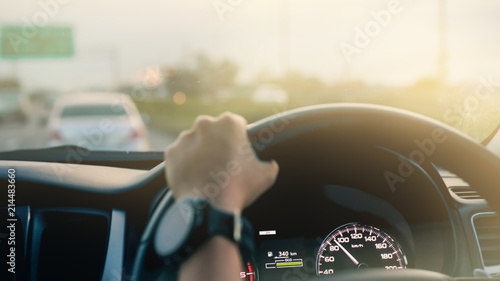 Driving a modern car on the road..