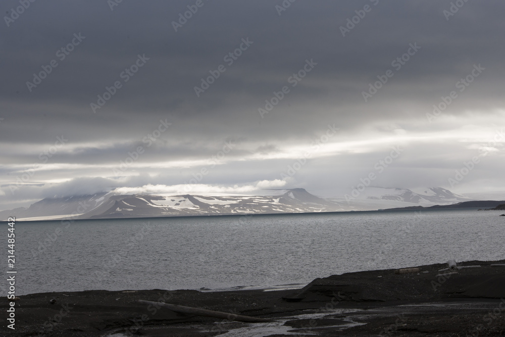 Majestic mountains landscape under sky with clouds in the Arctic Majestic mountains landscape under sky with clouds in the Arctic