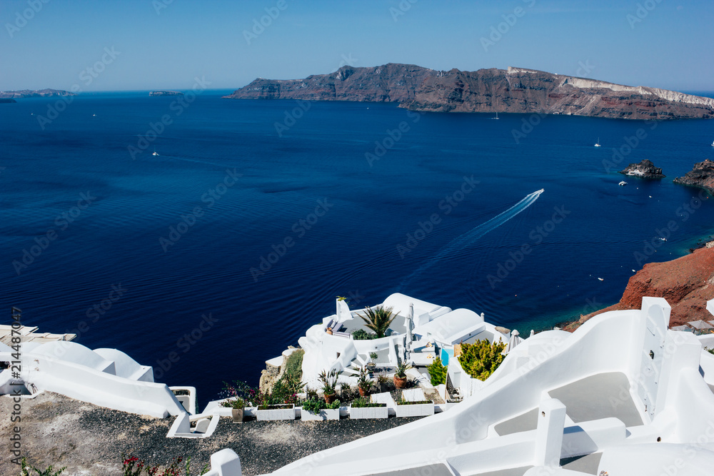 View of the sea and the caldera of Santorini, in the picture we can see some boats and their route