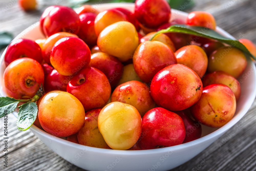 Fresh cherries - yellow berries. Sweet cherries, closeup of fruits in a bowl