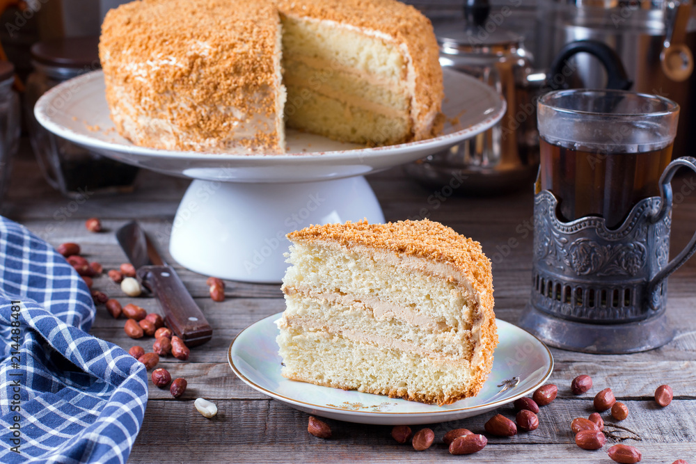 Homemade cake with cream on a wooden table Homemade cake with cream on a wooden table