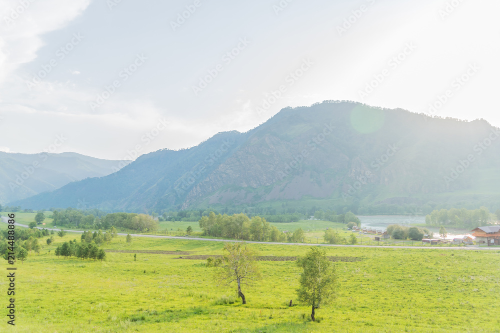 Summer mountains and the Altai river at sunset
