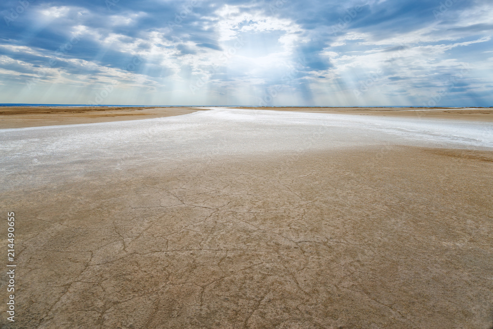 Salt dry river on the beach of lake Elton. Desert landscape with salt dried-up seasonal river.