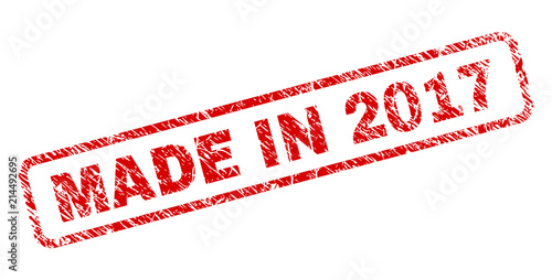 MADE IN 2017 stamp seal print with grunge style. Red vector rubber print of MADE IN 2017 caption with scratched texture. Text caption is placed inside rounded rectangle frame.