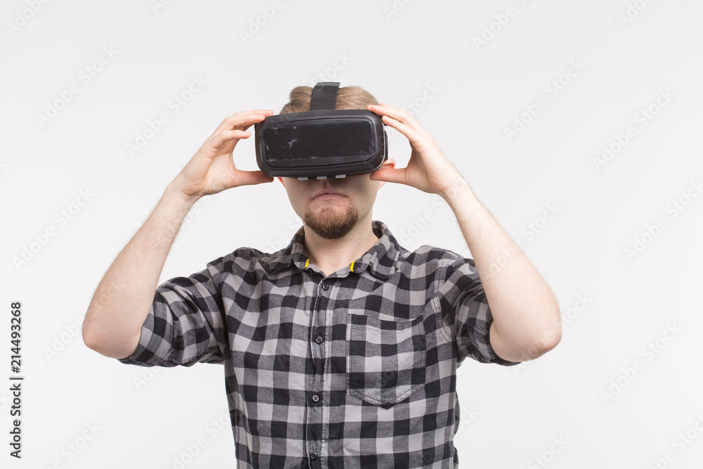 Man wearing virtual reality goggles on white background Man wearing virtual reality goggles on white background