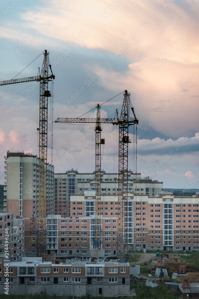 crane,construction cranes over building site silhouette with dramatic sky in the evening background,technology transportation material to high site crane,construction cranes over building site silhouette with dramatic sky in the evening background,technology transportation material to high site