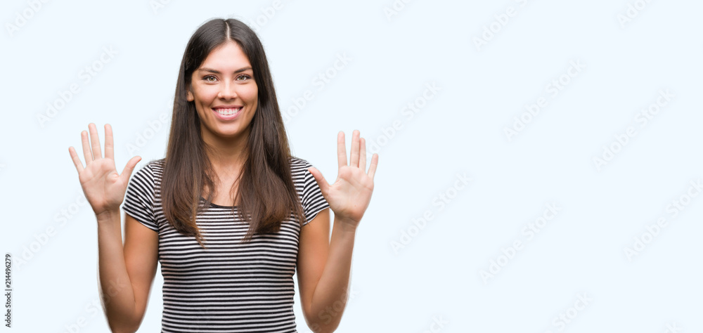Young beautiful hispanic woman showing and pointing up with fingers number ten while smiling confident and happy. Young beautiful hispanic woman showing and pointing up with fingers number ten while smiling confident and happy.