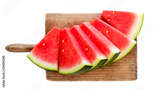 Slices of watermelon on cutting board isolated on white background, top view. Refreshing watermelon. Summer concept.