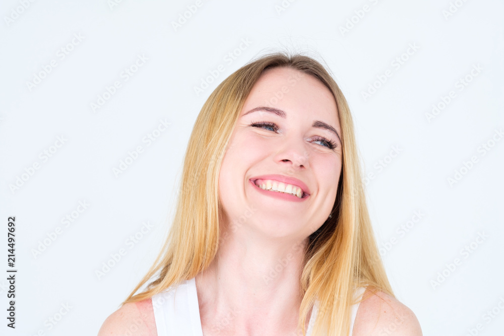 emotion face. very happy joyful thrilled to bits woman with beaming smile. young beautiful blond girl portrait on white background. emotion face. very happy joyful thrilled to bits woman with beaming smile. young beautiful blond girl portrait on white background.